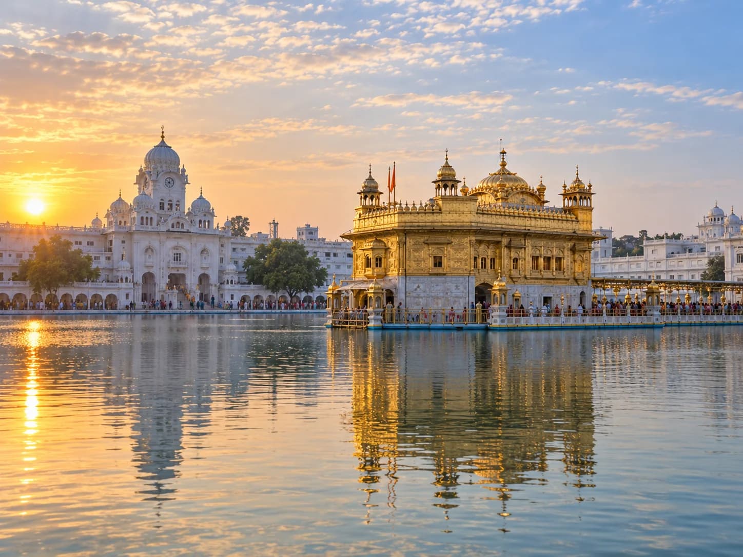 The Golden Temple in Amritsar at sunrise, reflected in the sarovar